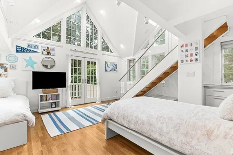 a living room with a flat screen tv and a couch