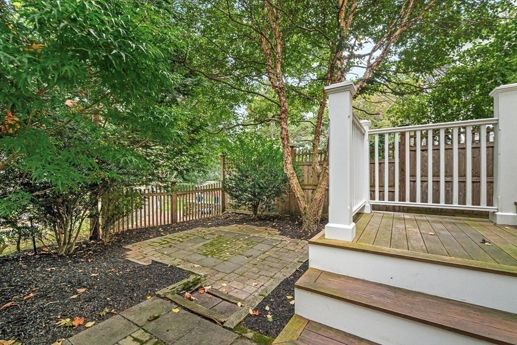 104 Church Street Winchester, MA 01890 - Photo 36 of 42 a view of a backyard with a deck