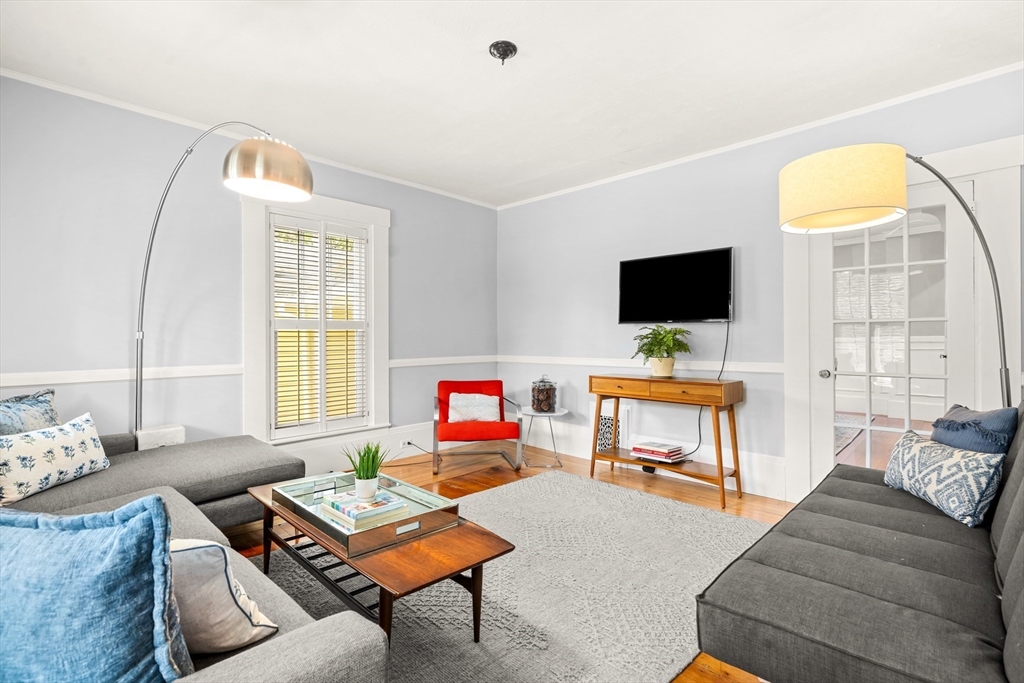 104 Church Street Winchester, MA 01890 - Photo 7 of 42 a living room with furniture and a flat screen tv