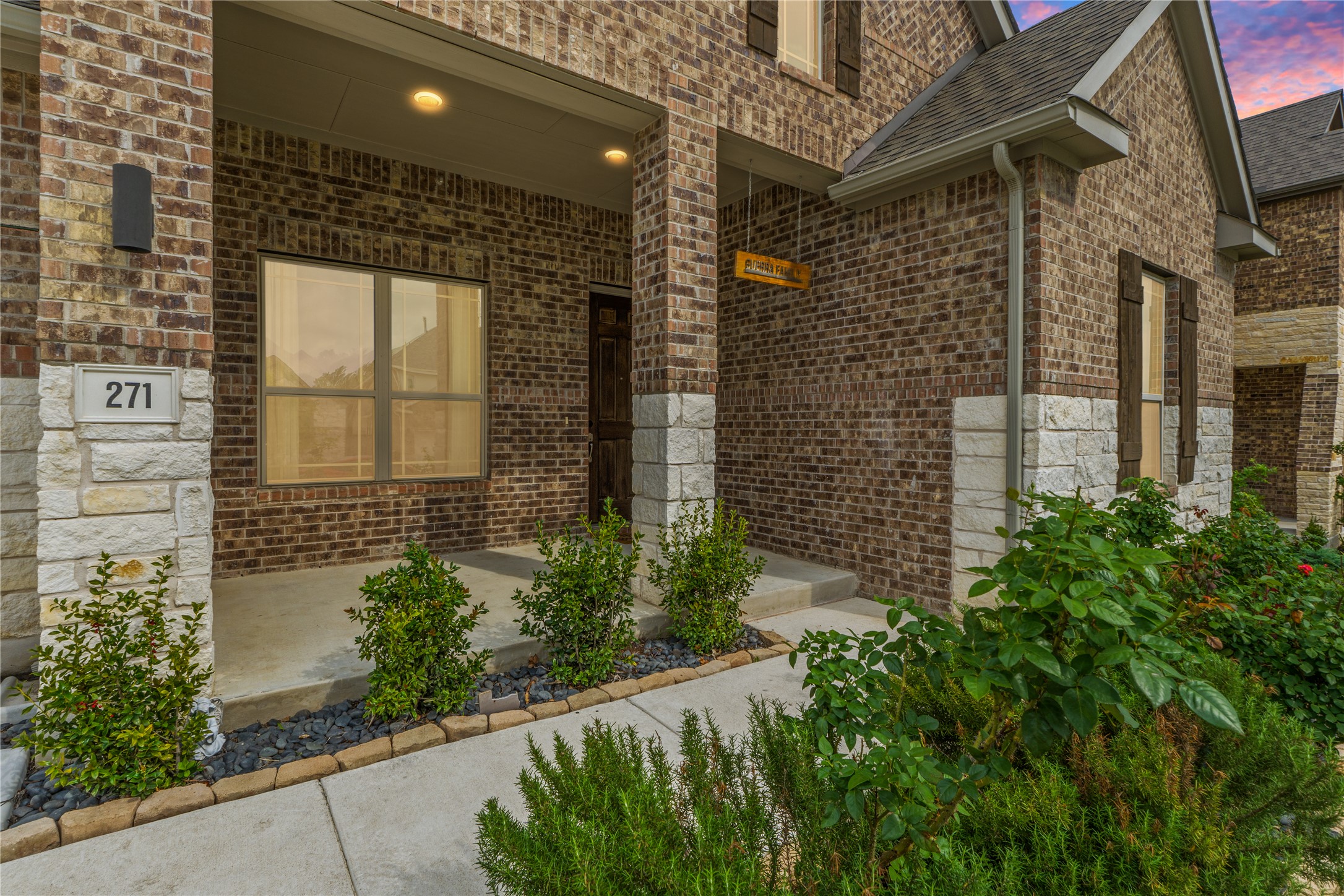 271 Tubman Drive Kyle, TX 78640 - Photo 2 of 40 a brick building with a yard