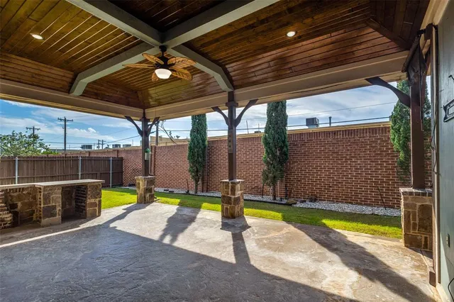 a view of swimming pool with a patio