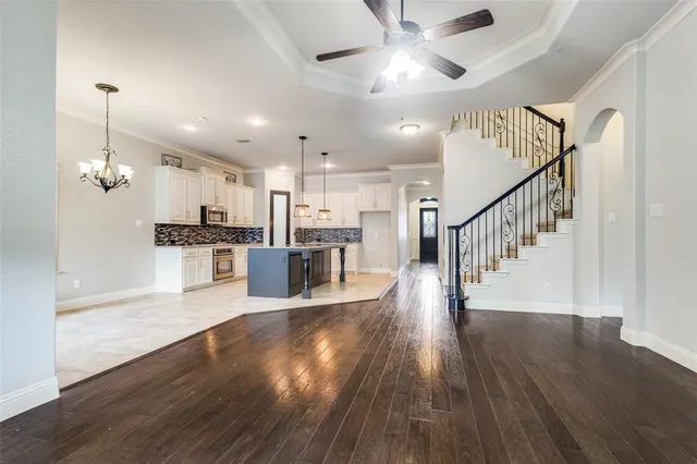a view of kitchen with cabinets and wooden floor