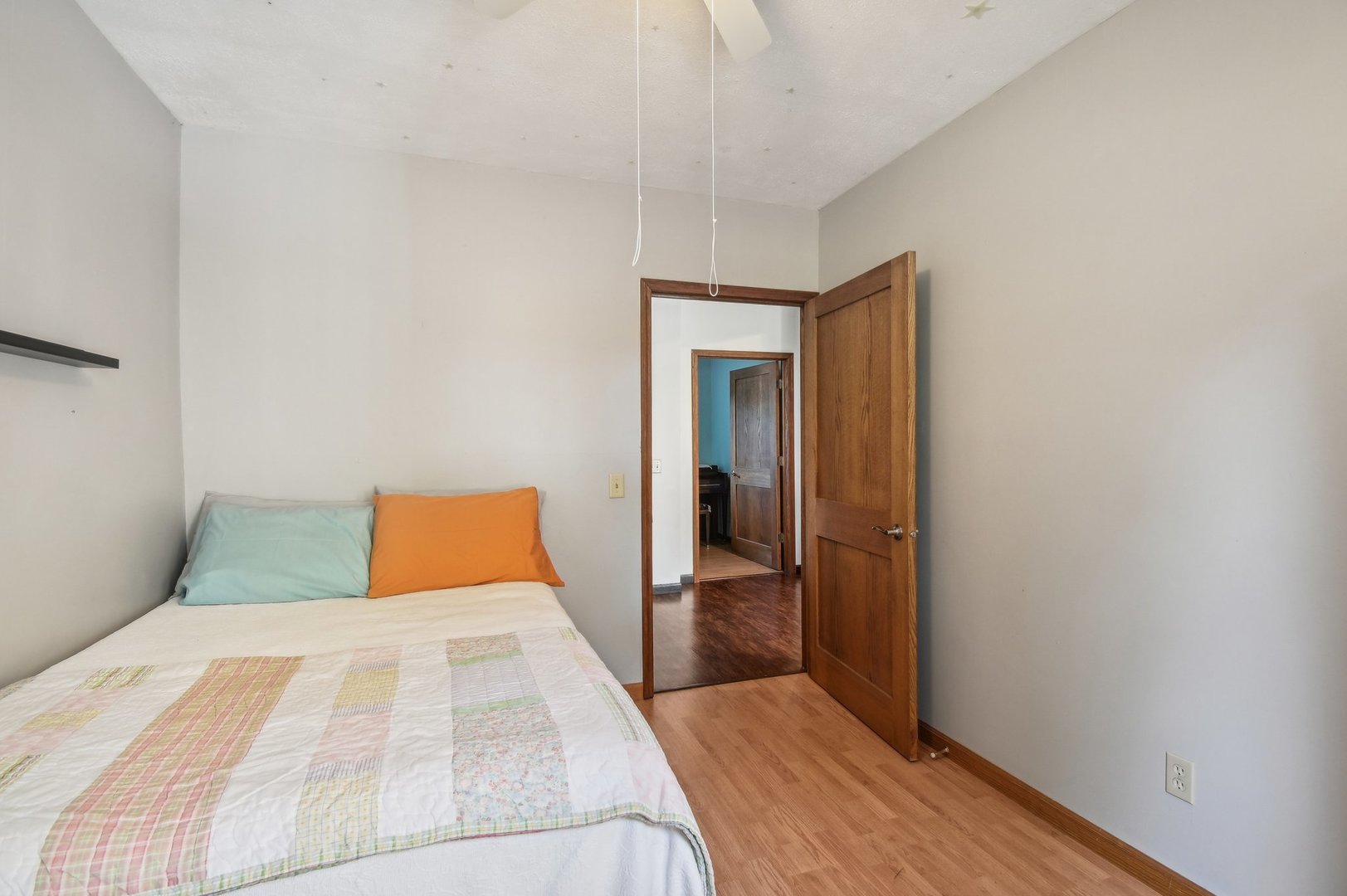 2900 Gabriel Avenue Zion, IL 60099 - Photo 24 of 52 a bedroom with a bed and wooden floor