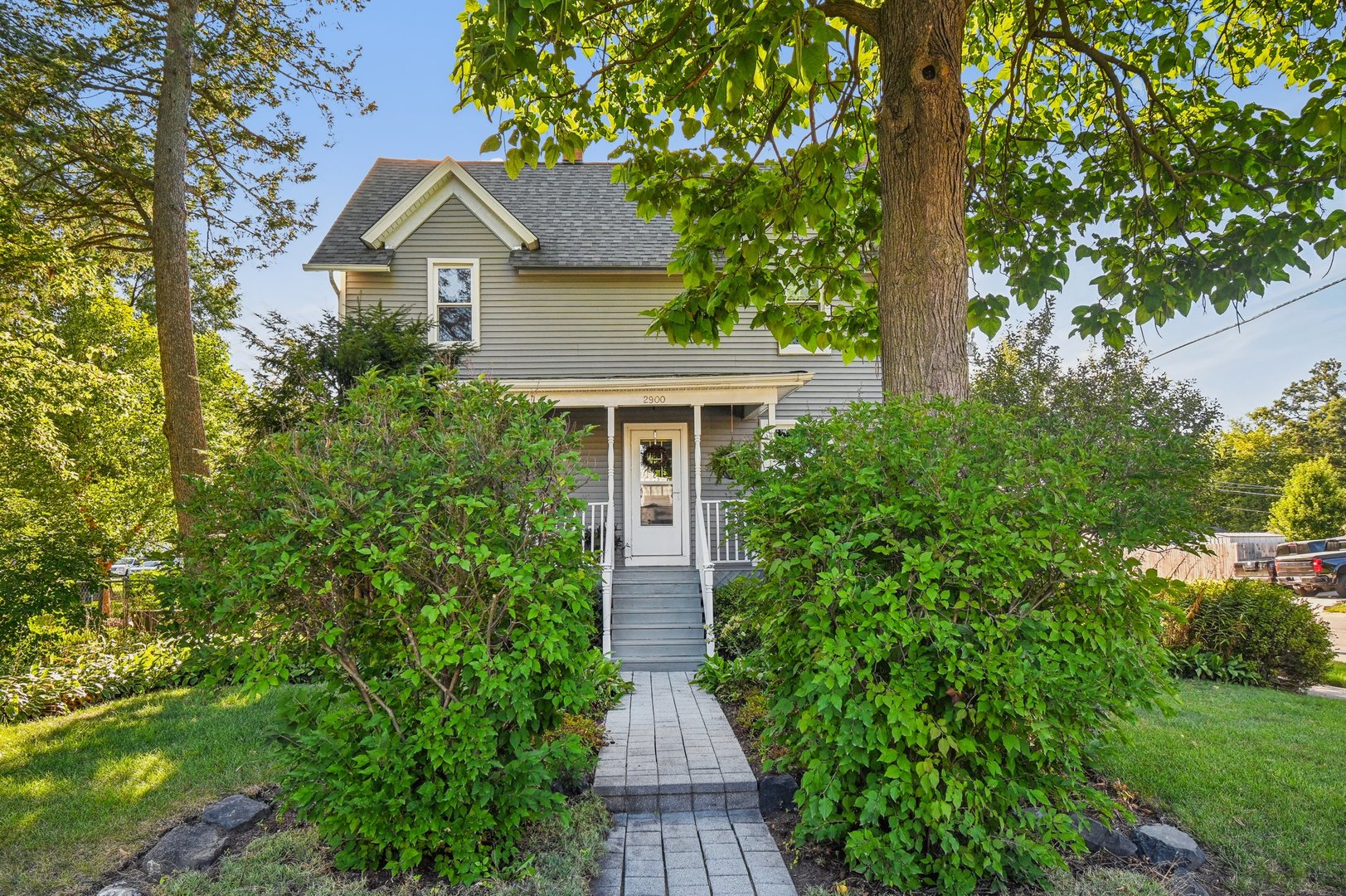 2900 Gabriel Avenue Zion, IL 60099 - Photo 4 of 52 a front view of a house with yard and trees