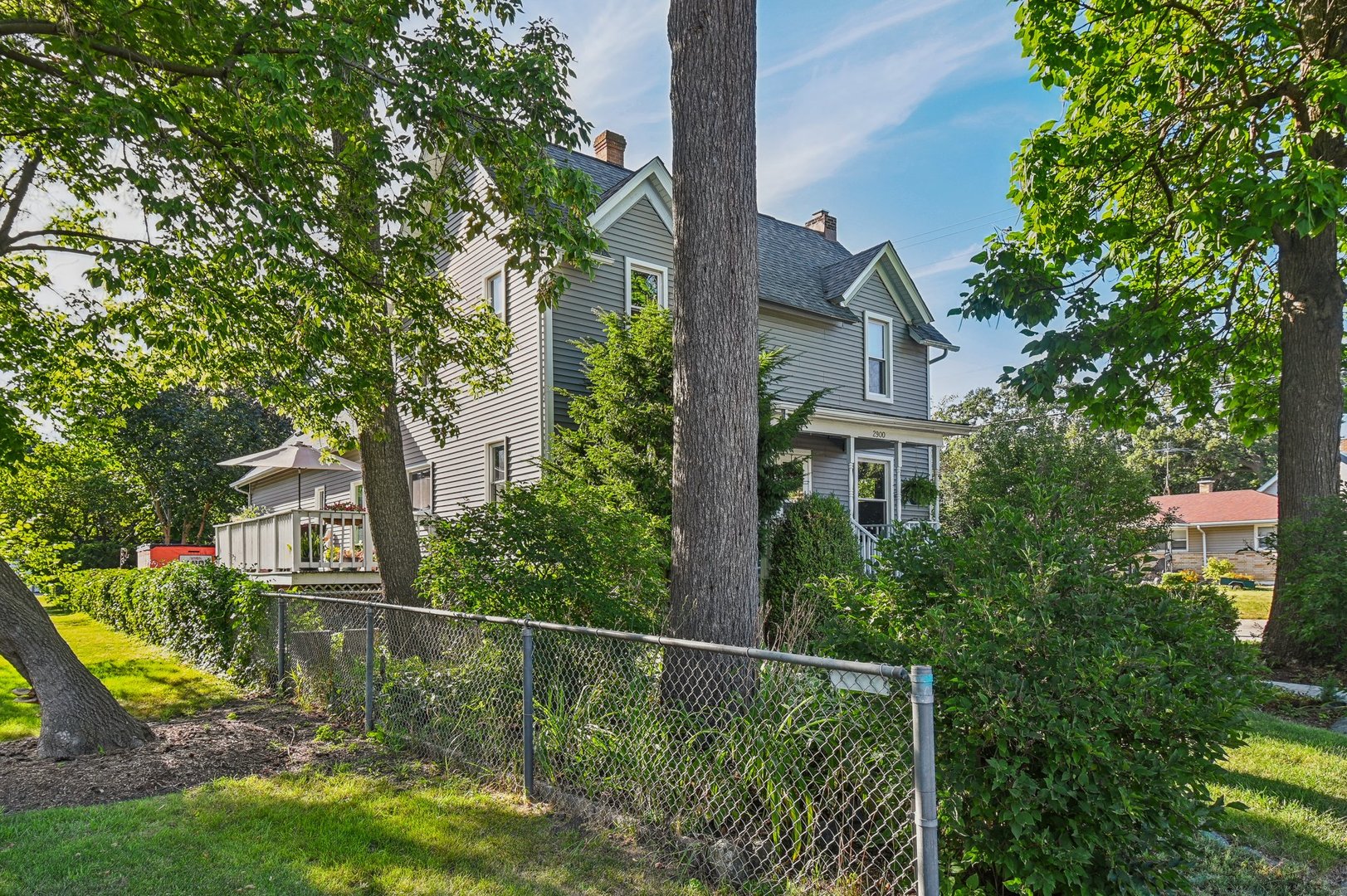 2900 Gabriel Avenue Zion, IL 60099 - Photo 47 of 52 a view of a house with a small yard plants and large tree