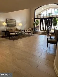 a view of a swimming pool and outdoor seating