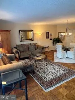 a living room with furniture and a rug