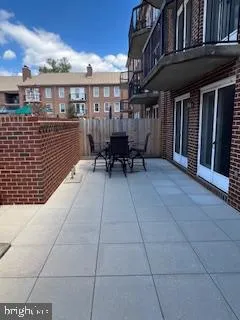 a view of a building with outdoor seating