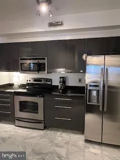 a kitchen with a sink and a stove