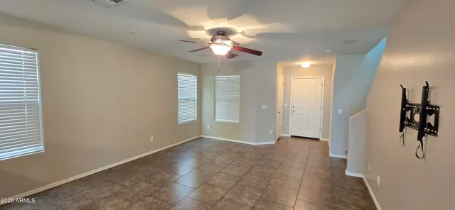 a kitchen with stainless steel appliances granite countertop a stove refrigerator sink and microwave