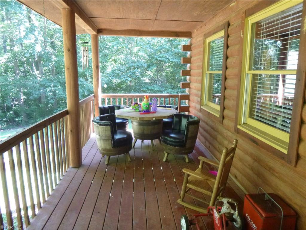 3057 Pierce Meadow Road Denton, NC 27239 - Photo 3 of 25 Large front porch spanning the entire front of the house