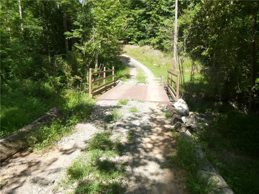 3057 Pierce Meadow Road Denton, NC 27239 - Photo 23 of 25 4/10th mile private drive with bridge over the creek