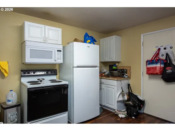 a utility room with closet dryer and washer