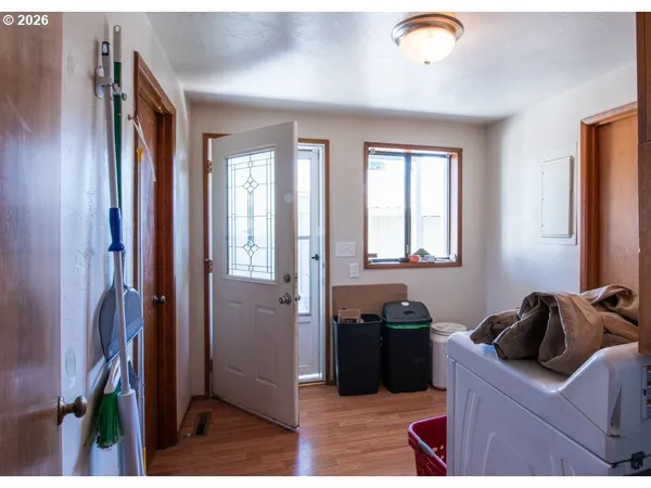 a kitchen with stainless steel appliances kitchen island granite countertop a refrigerator and a sink