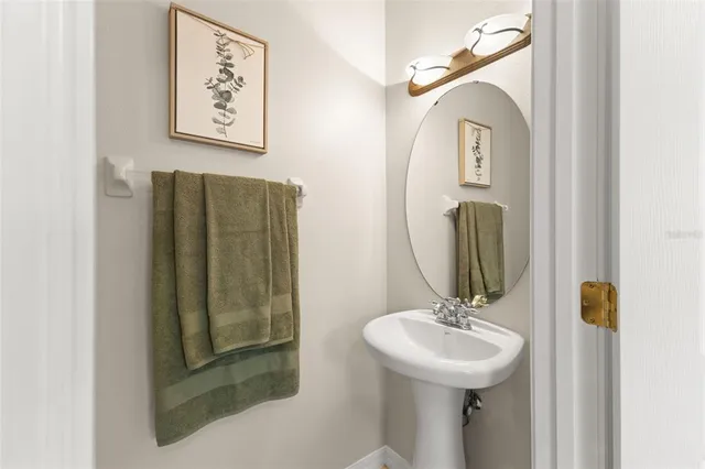 a bathroom with a sink and mirror