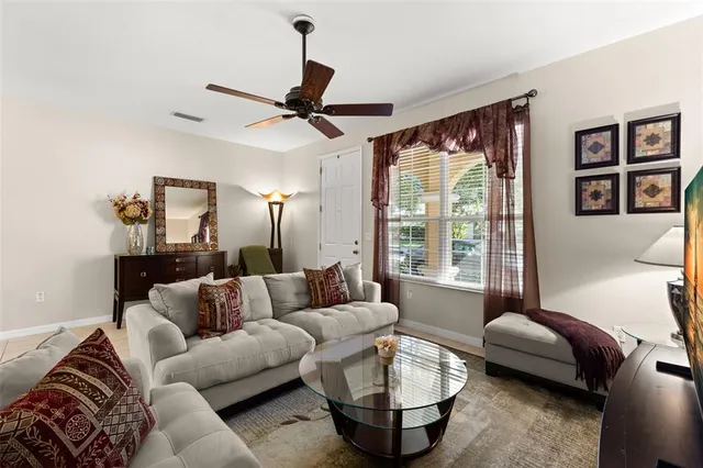 a living room with furniture and a large window