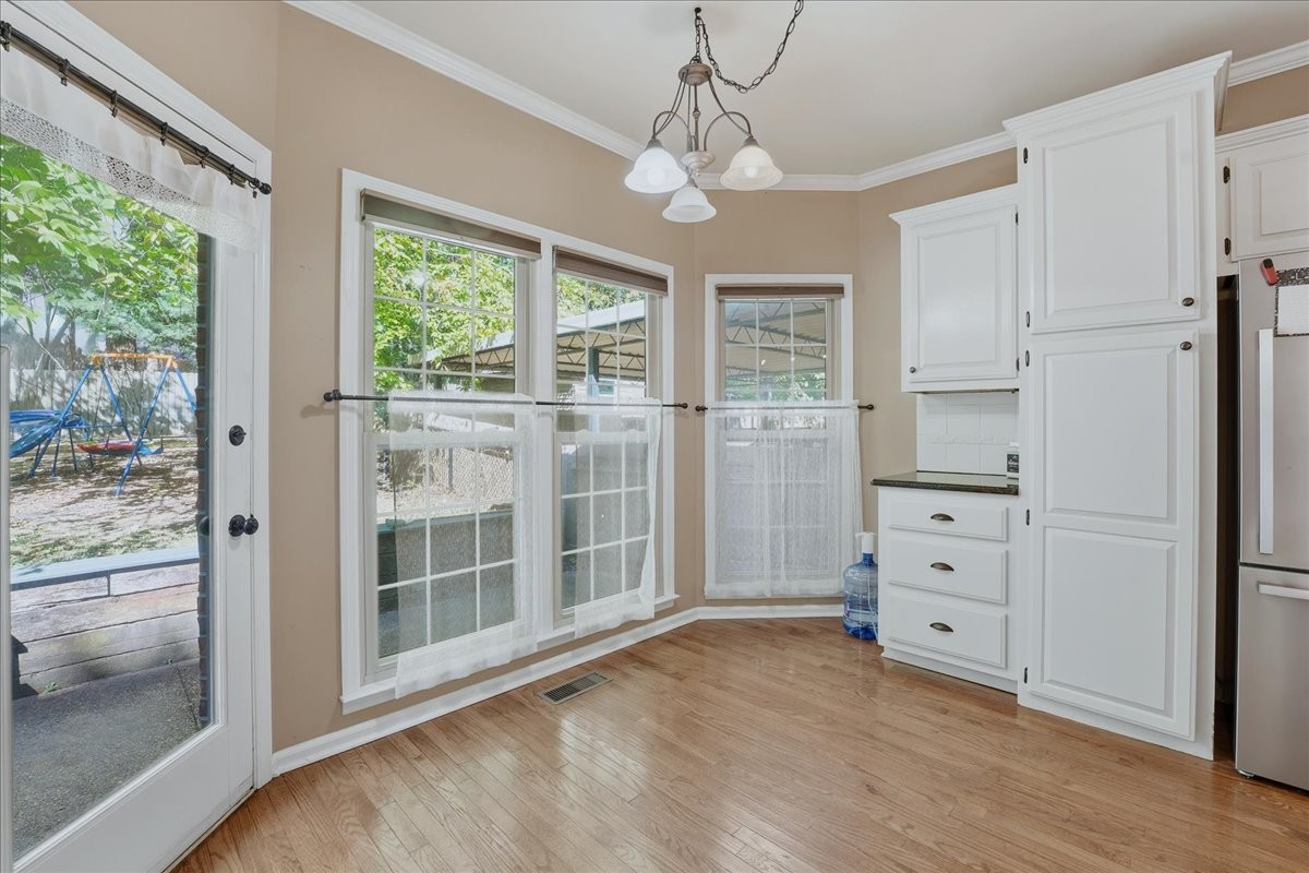 104 Kemper Court Springfield, TN 37172 - Photo 14 of 40 a view of wooden floor and windows in a room