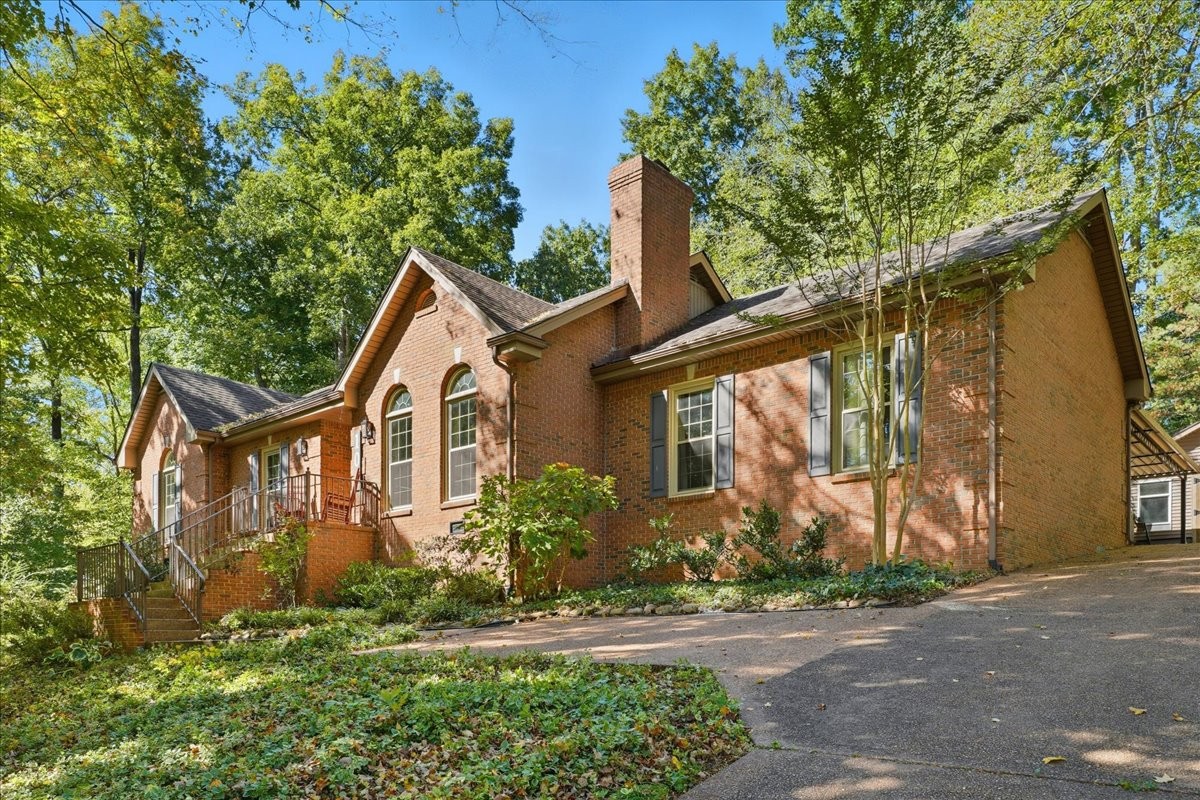 104 Kemper Court Springfield, TN 37172 - Photo 2 of 40 a front view of a house with a yard and tree
