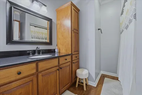 a bathroom with a sink a mirror and a toilet