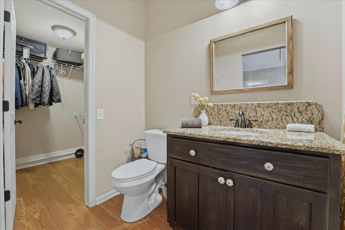 104 Kemper Court Springfield, TN 37172 - Photo 28 of 40 a bathroom with a granite countertop sink a toilet and a mirror