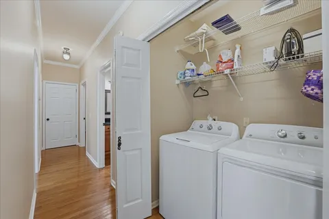 a view of a patio with a table and chairs