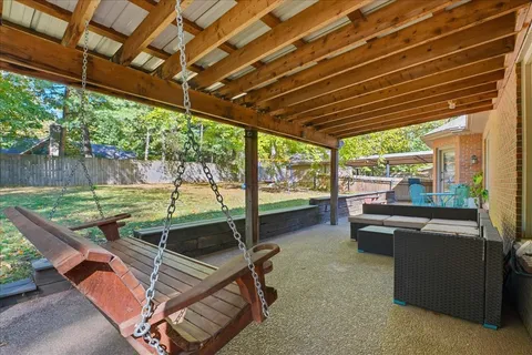 a backyard of a house with outdoor seating