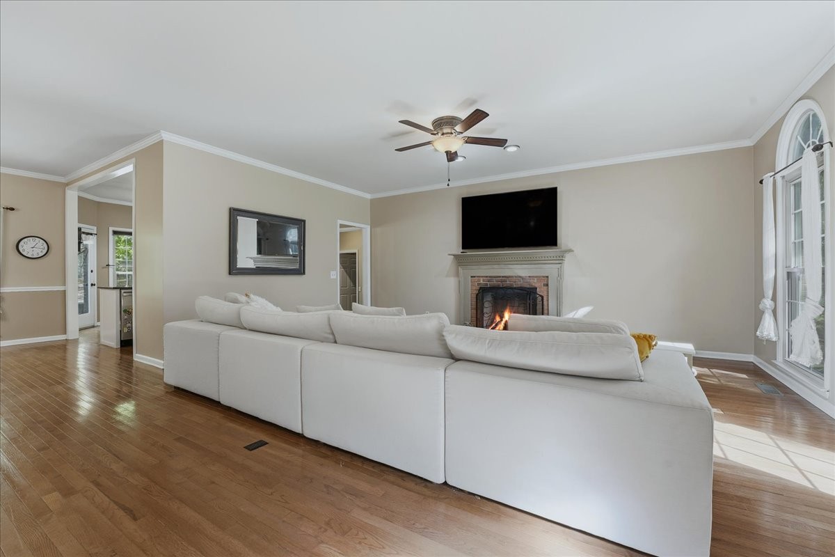 104 Kemper Court Springfield, TN 37172 - Photo 6 of 40 a living room with furniture a fireplace and a flat screen tv