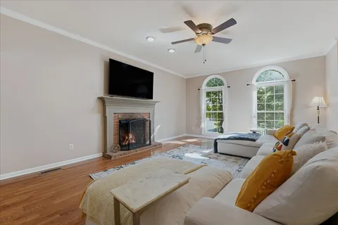 a living room with furniture fireplace and a flat screen tv
