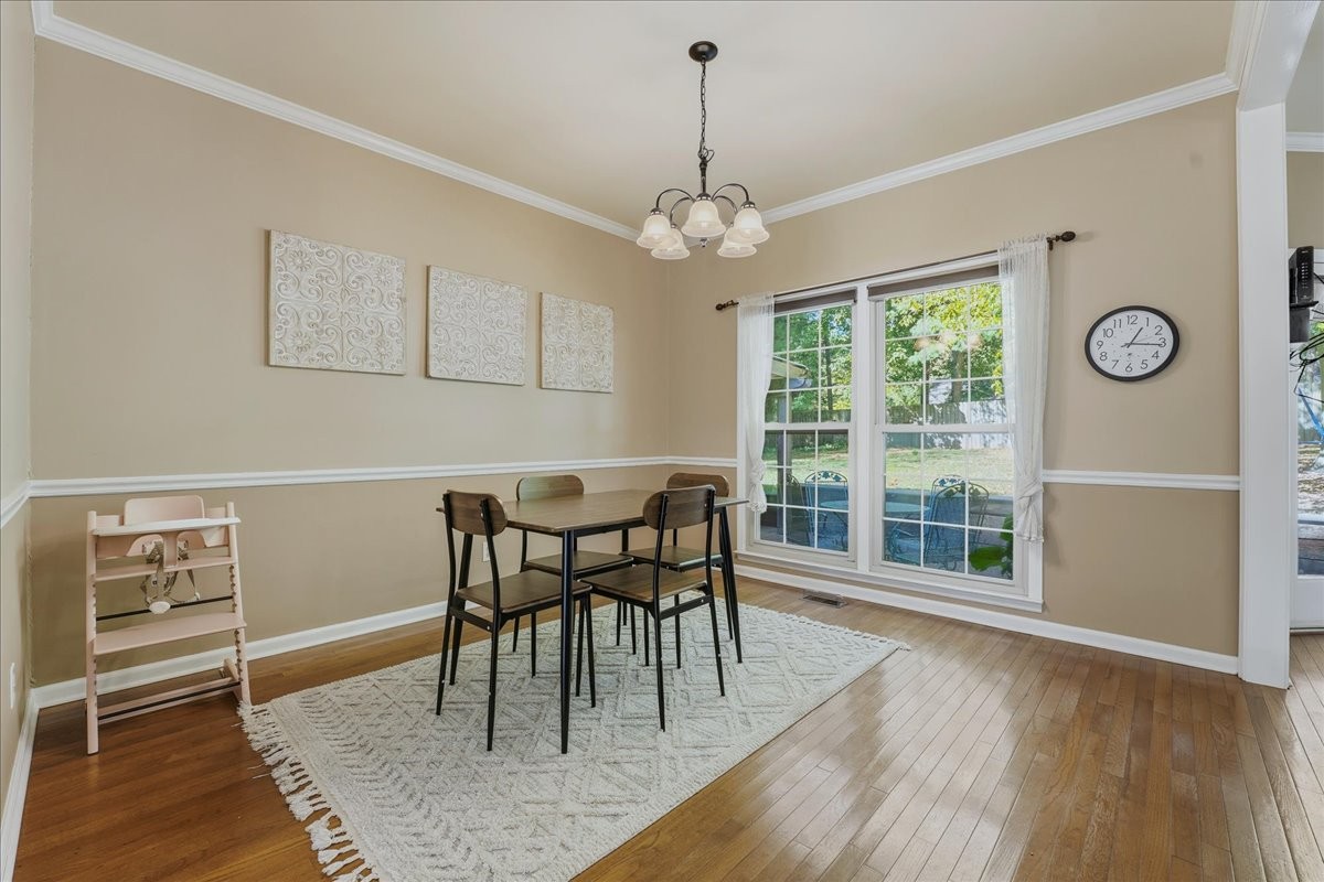 104 Kemper Court Springfield, TN 37172 - Photo 9 of 40 a view of a dining room with furniture window and wooden floor