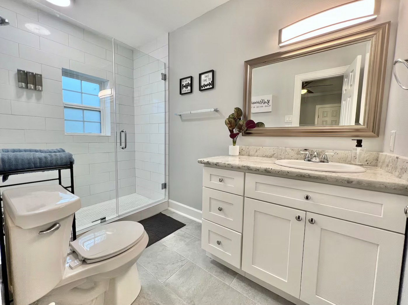 1508 Ridgewood Street, Unit A Houston, TX 77006 - Photo 11 of 16 a bathroom with a toilet a sink and mirror