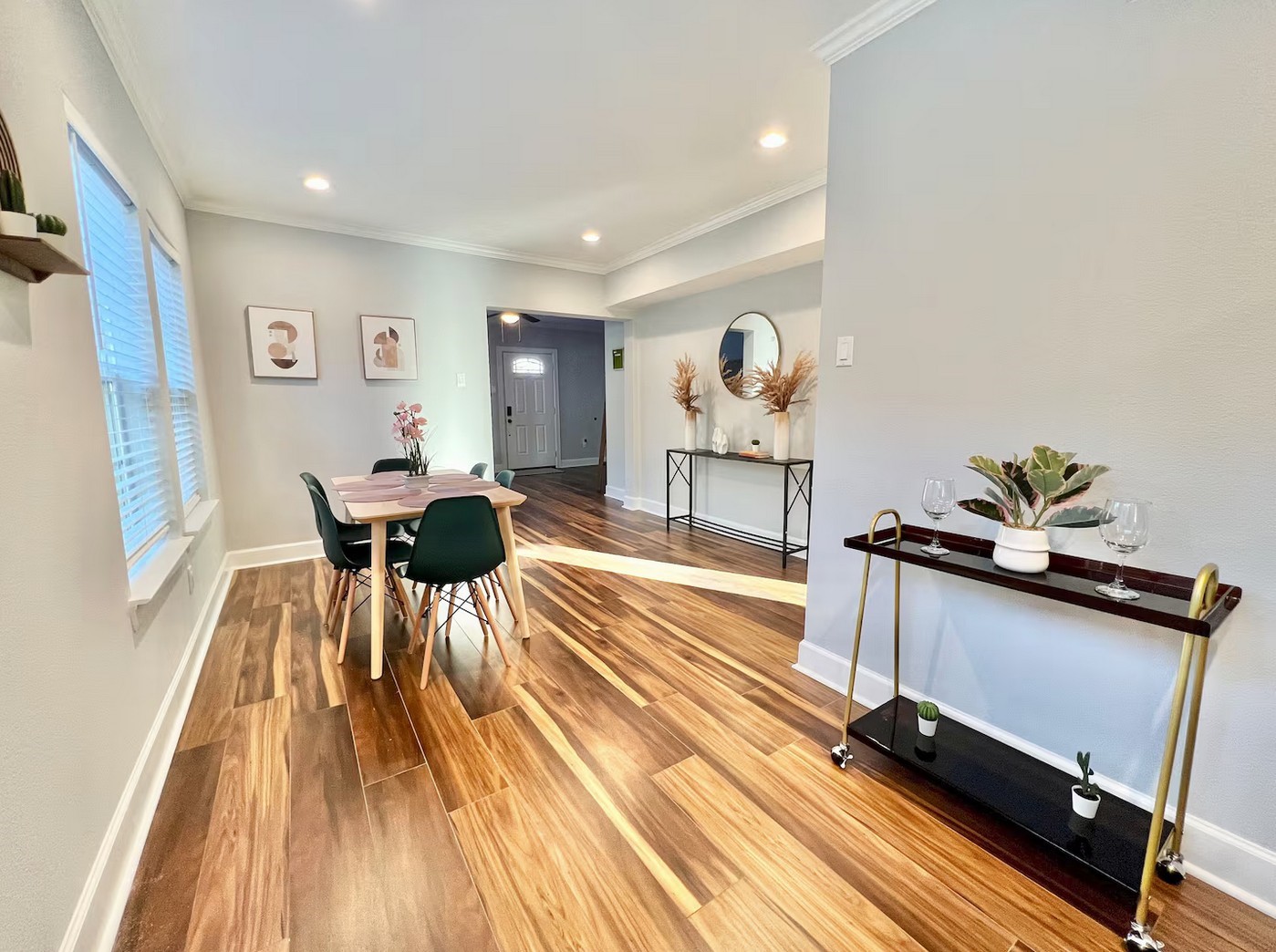 1508 Ridgewood Street, Unit A Houston, TX 77006 - Photo 4 of 16 a living room with furniture a wooden floor and next to a window