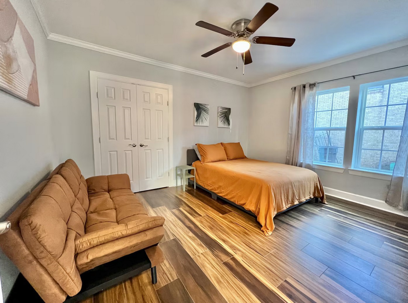 1508 Ridgewood Street, Unit A Houston, TX 77006 - Photo 9 of 16 a bedroom with a bed couch and window