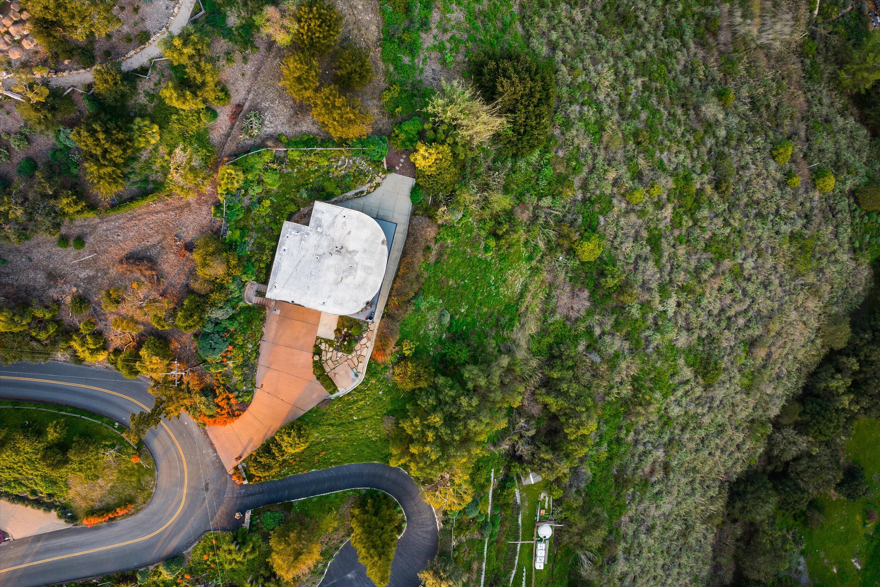 128 Las Alturas Road Santa Barbara, CA 93103 - Photo 15 of 36 an aerial view of a house with a yard and trees