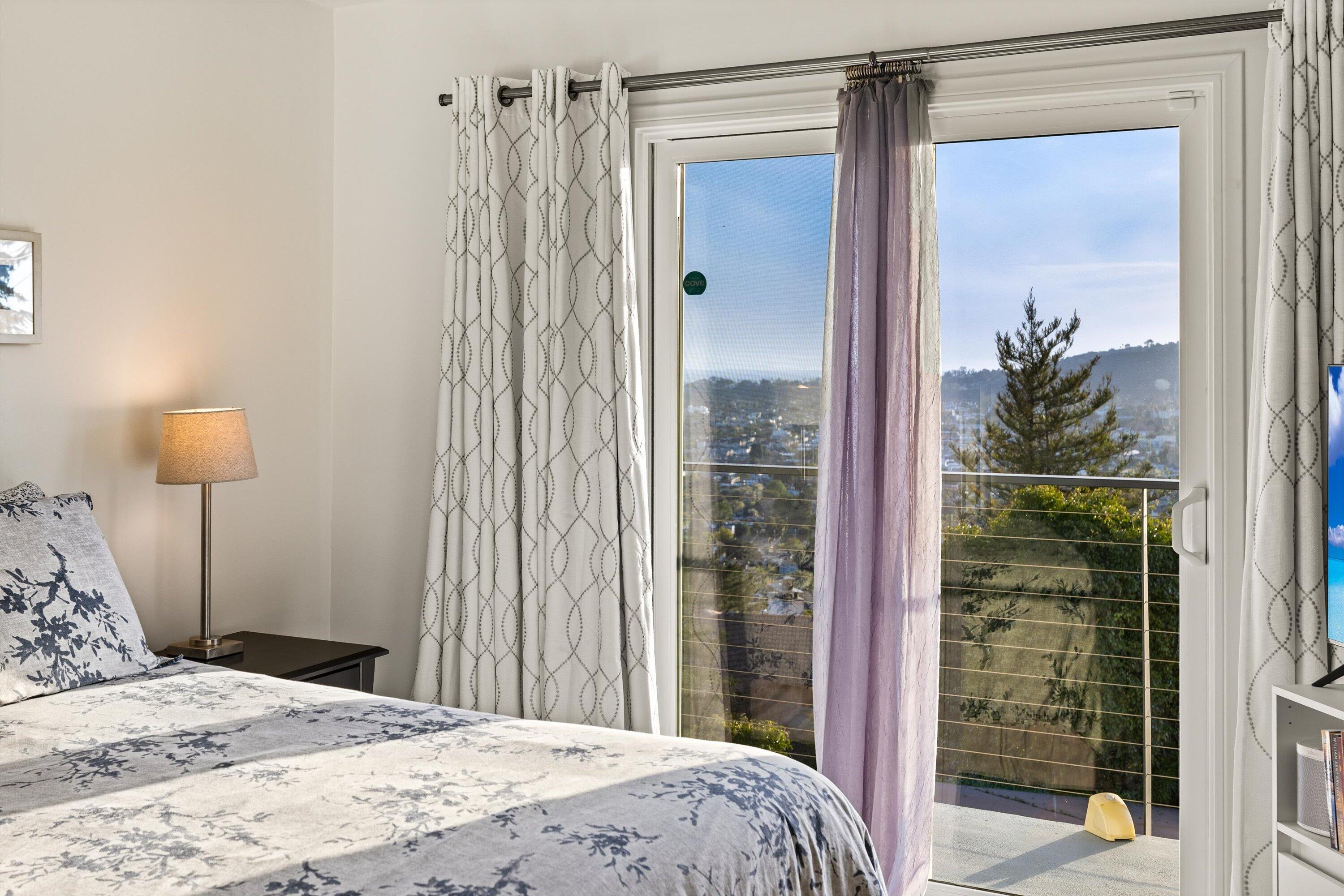 128 Las Alturas Road Santa Barbara, CA 93103 - Photo 21 of 36 a bedroom with a bed and a mirror