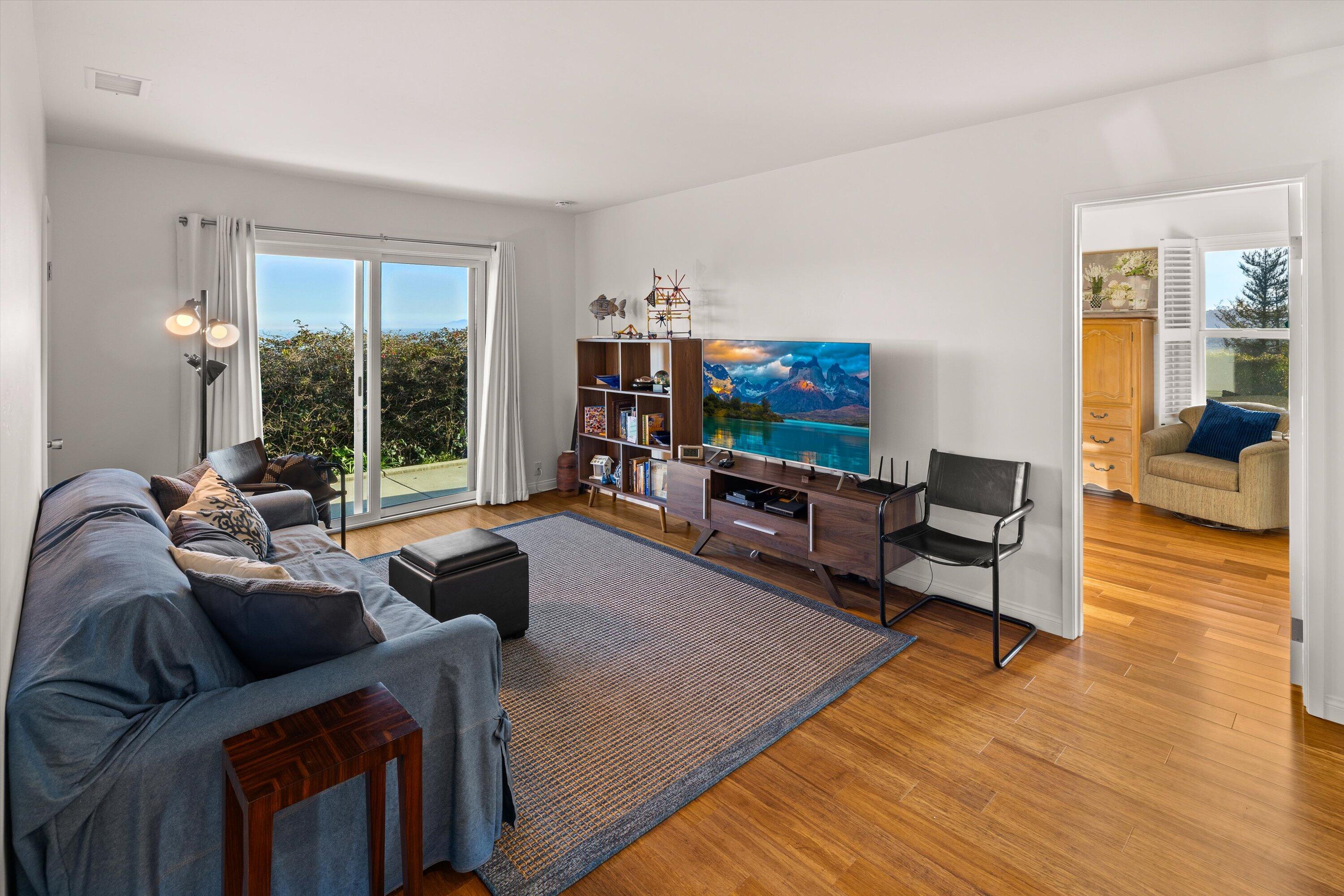 128 Las Alturas Road Santa Barbara, CA 93103 - Photo 24 of 36 a living room with furniture and a wooden floor