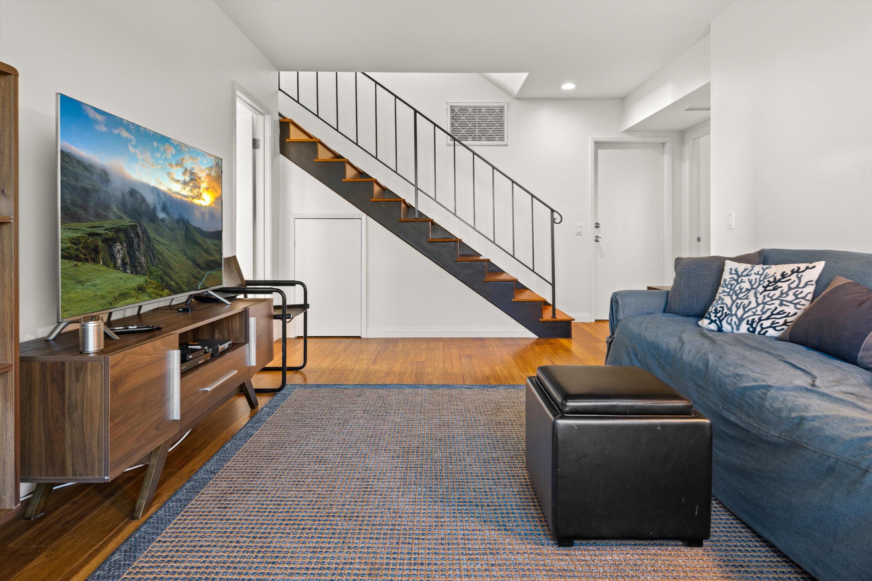 128 Las Alturas Road Santa Barbara, CA 93103 - Photo 25 of 36 a living room with furniture and a flat screen tv