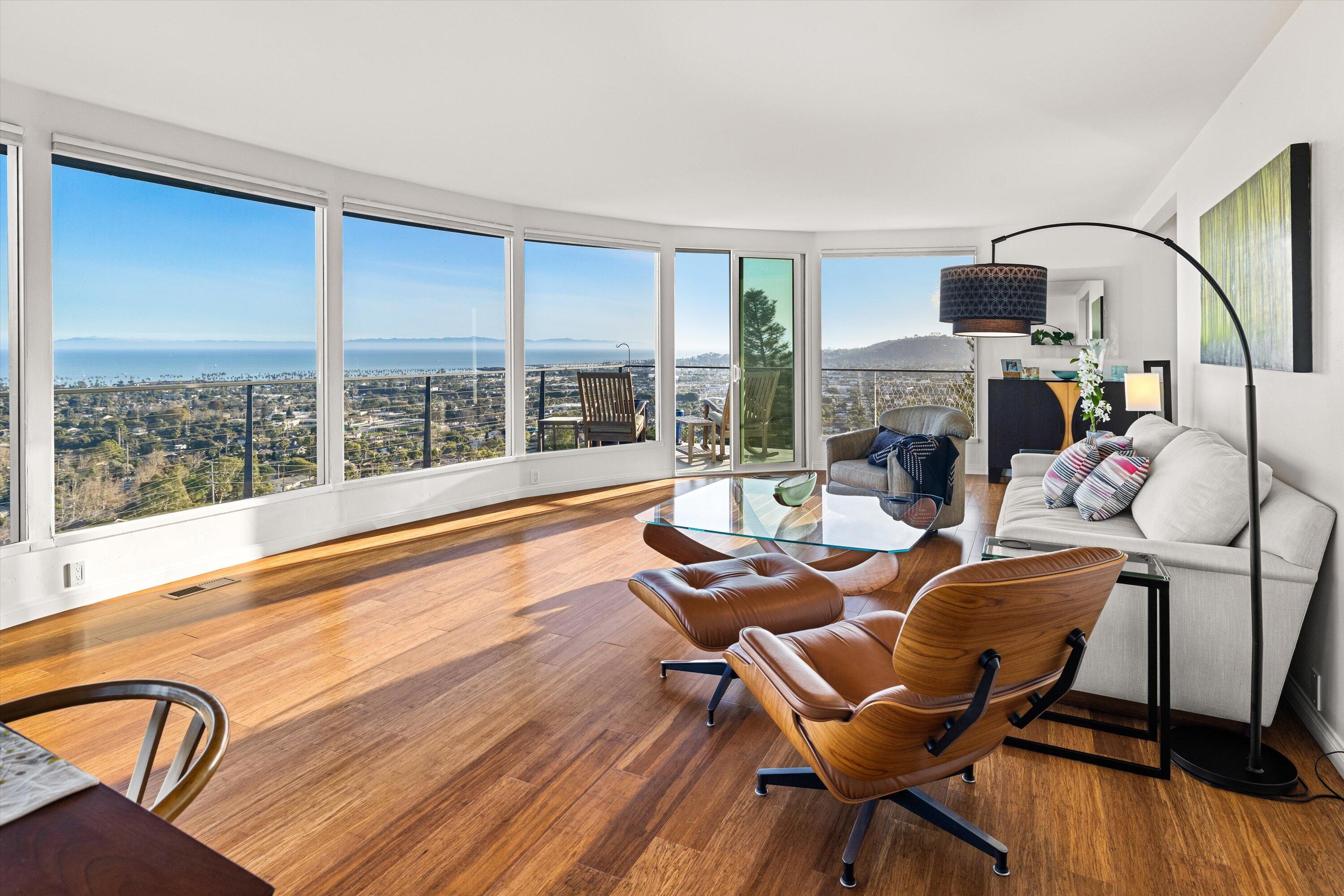 128 Las Alturas Road Santa Barbara, CA 93103 - Photo 3 of 36 a living room with fireplace furniture and a large window