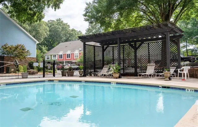 a view of a swimming pool with a patio