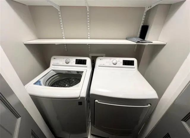a utility room with dryer and washer