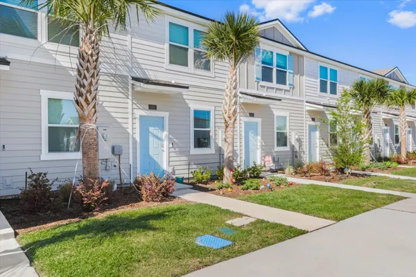 a front view of a house with a yard