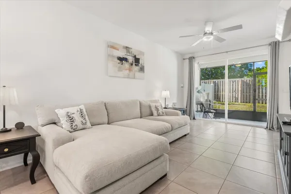 a living room with furniture and a large window