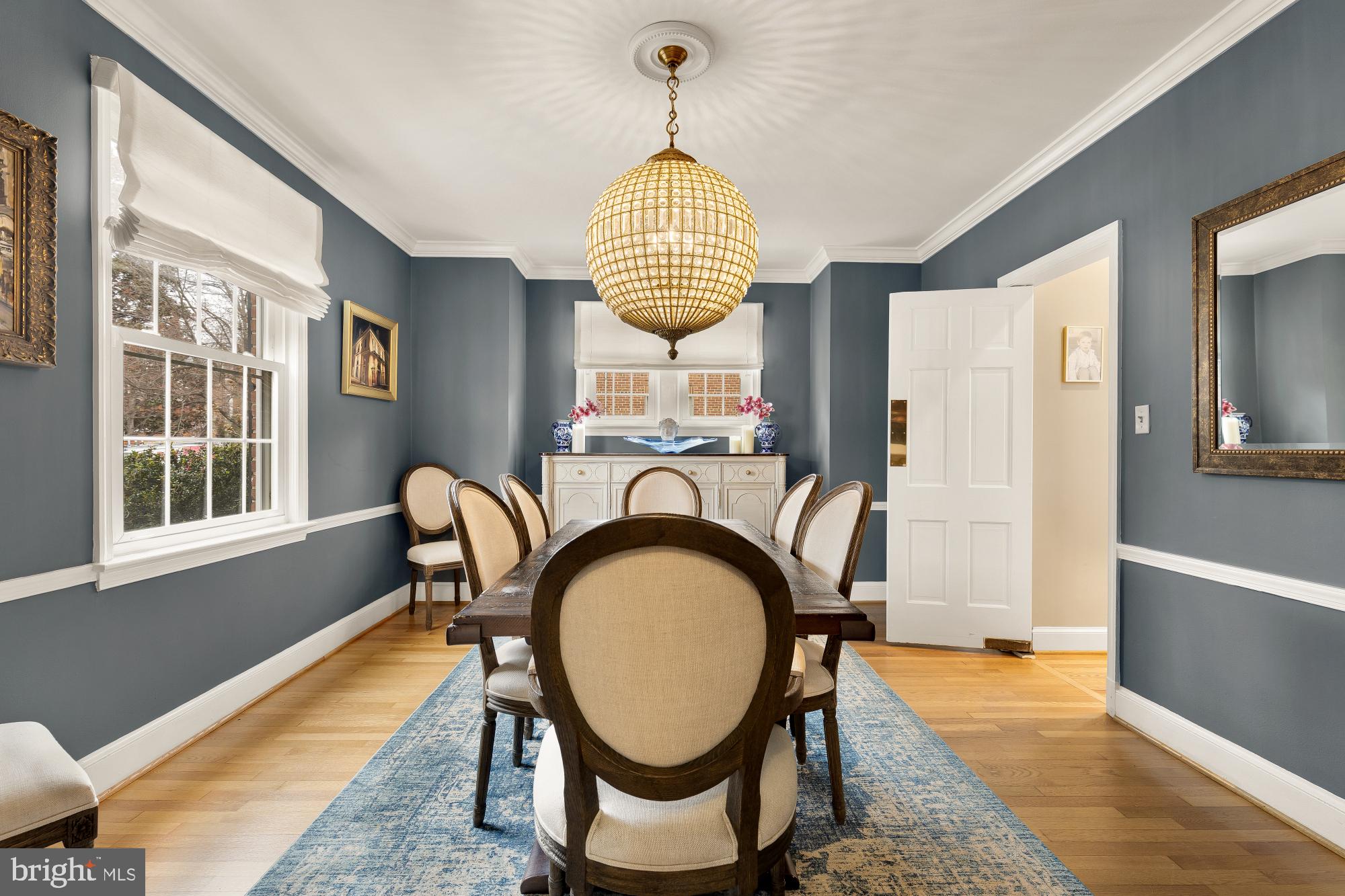 4109 17th Street Northwest Washington, DC 20011 - Photo 12 of 47 a dining room with furniture a chandelier and wooden floor