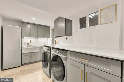 a view of a house with a yard and lawn chairs