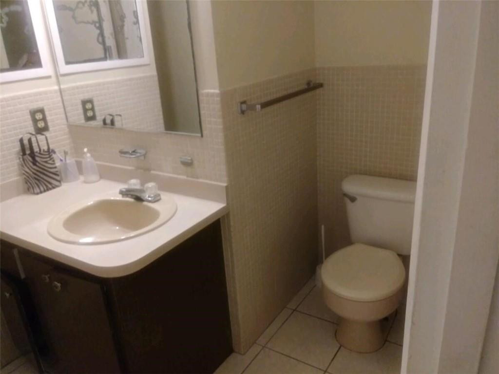 13301 Southwest 99th Place Miami, FL 33176 - Photo 6 of 11 a bathroom with a sink toilet and a mirror