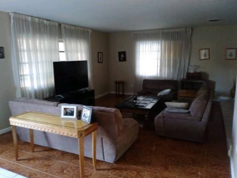 13301 Southwest 99th Place Miami, FL 33176 - Photo 10 of 11 a living room with furniture and a flat screen tv