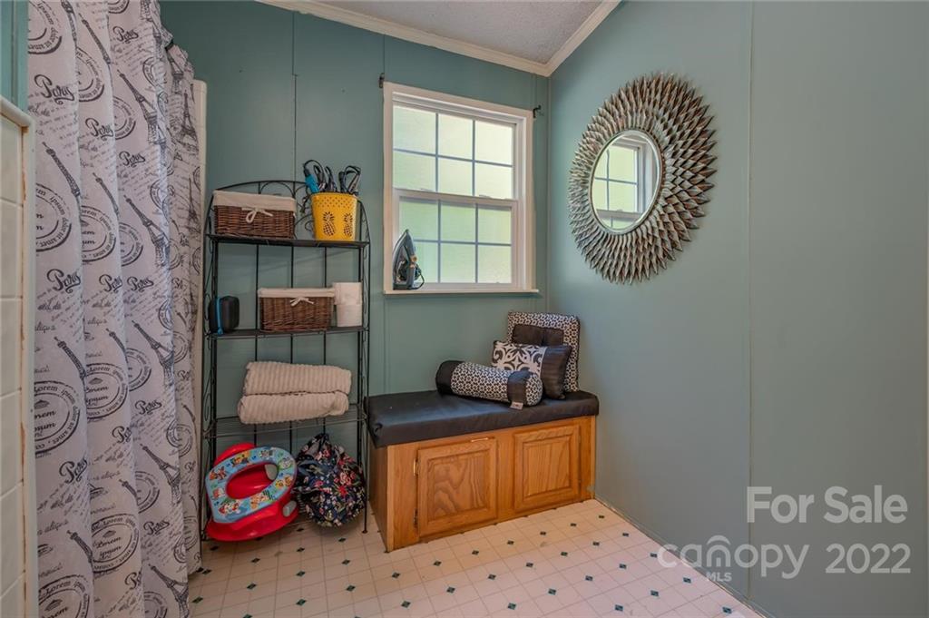 280 Highway 9 Mill Spring, NC 28756 - Photo 12 of 18 a bedroom with a bed and a window
