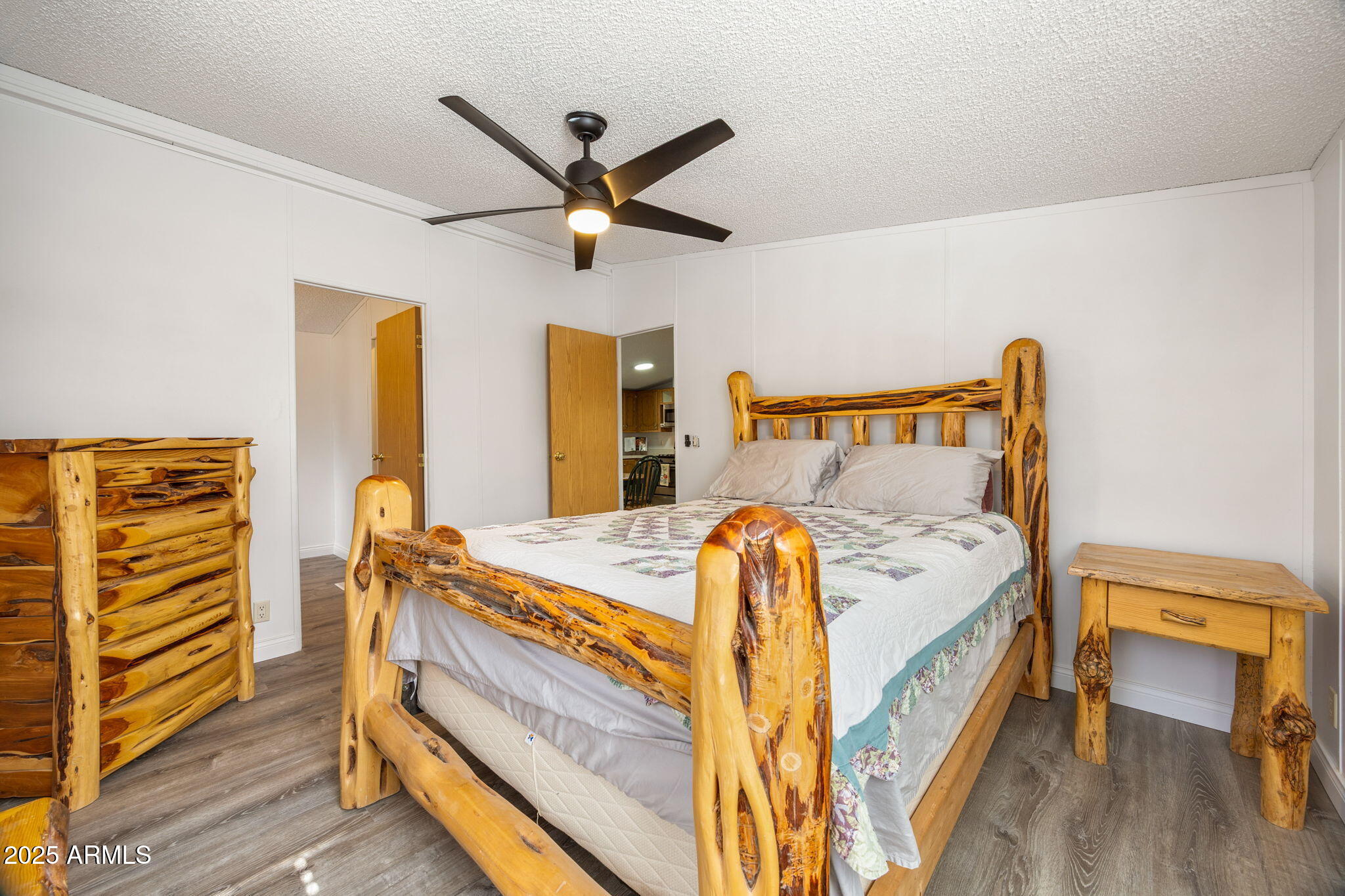 2064 Pinewood Drive Overgaard, AZ 85933 - Photo 11 of 33 a bed room with a bed and a window