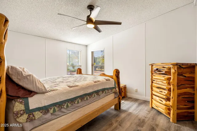 a bed room with a bed and a television