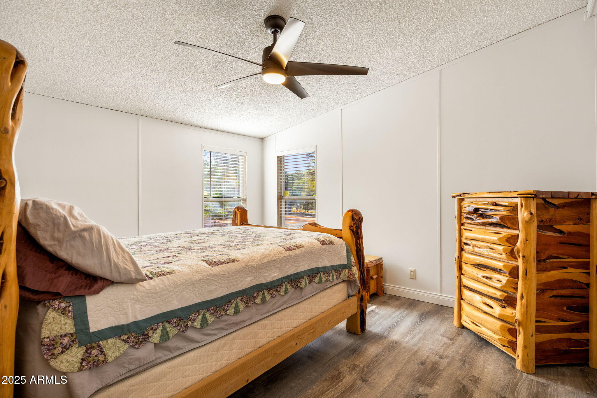 2064 Pinewood Drive Overgaard, AZ 85933 - Photo 12 of 33 a bed room with a bed and a television