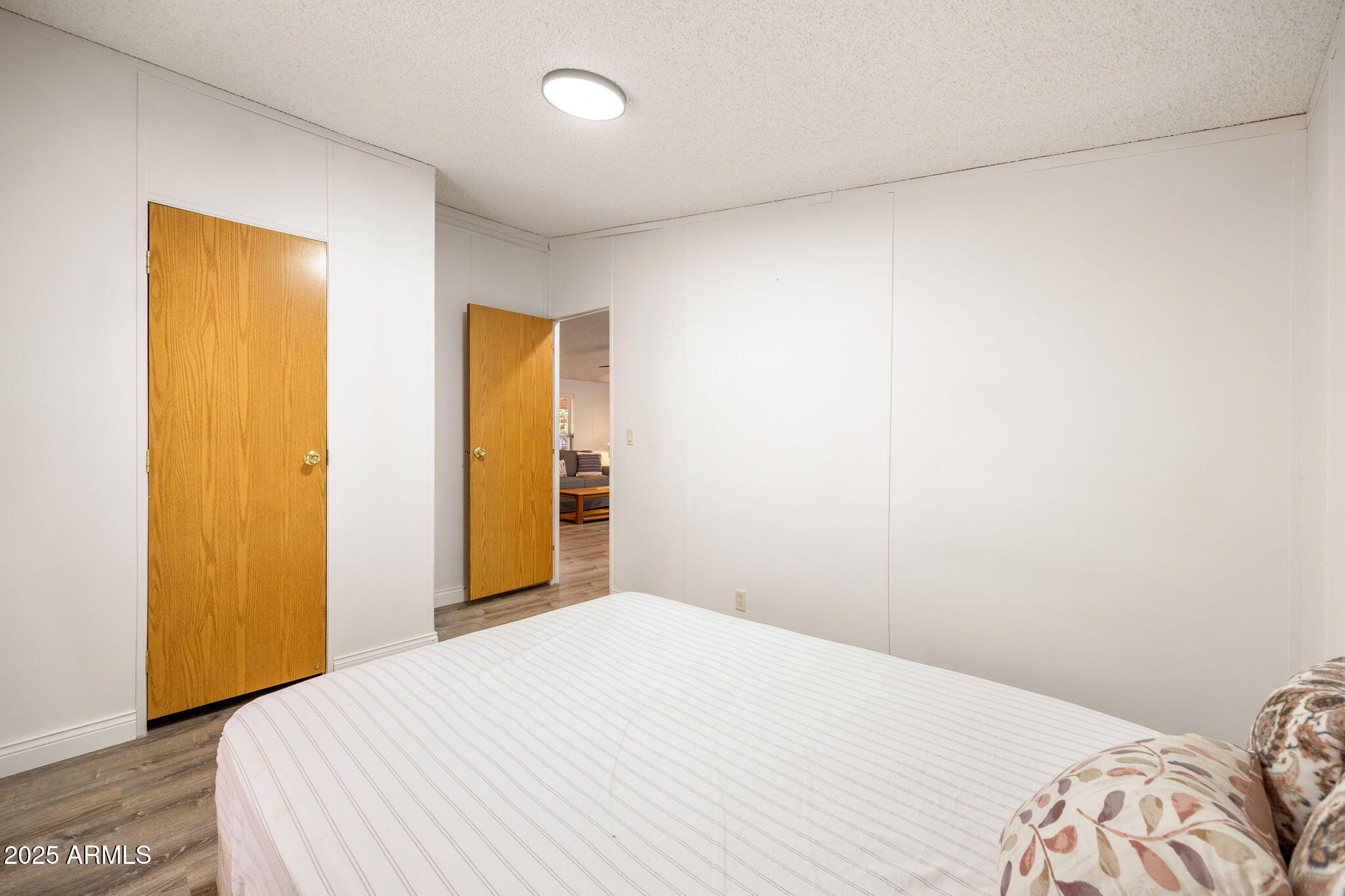 2064 Pinewood Drive Overgaard, AZ 85933 - Photo 18 of 33 a bedroom with a bed and a closet